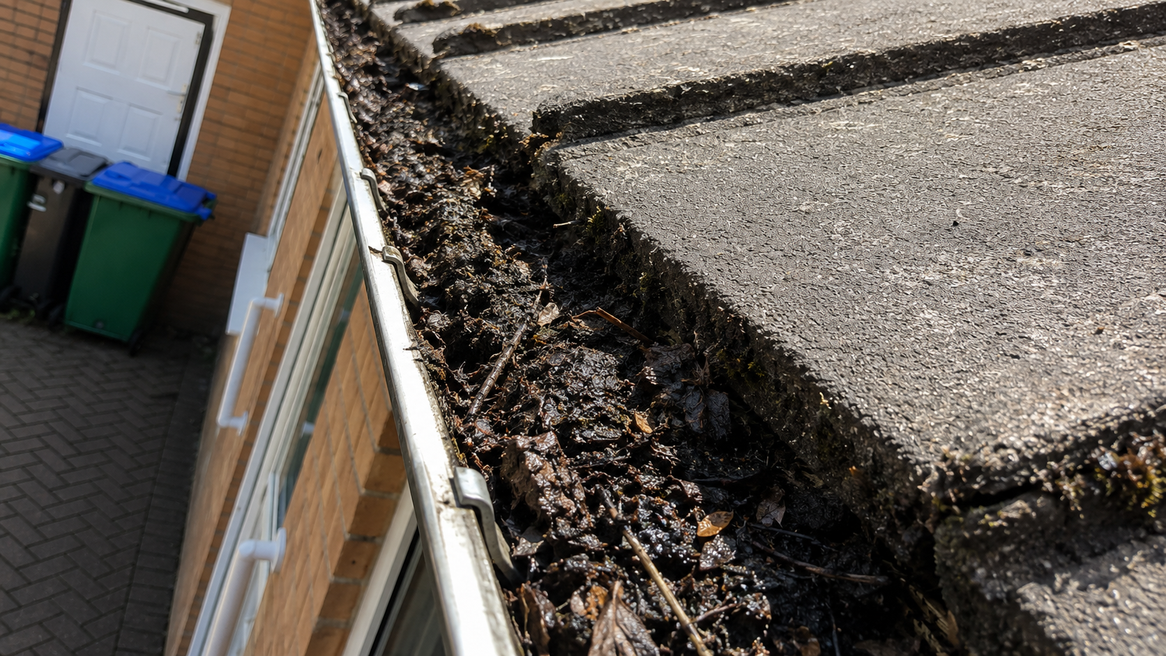 Before gutter cleaning — showing the debris and hidden defects that accumulate unnoticed in Birmingham gutters during summer